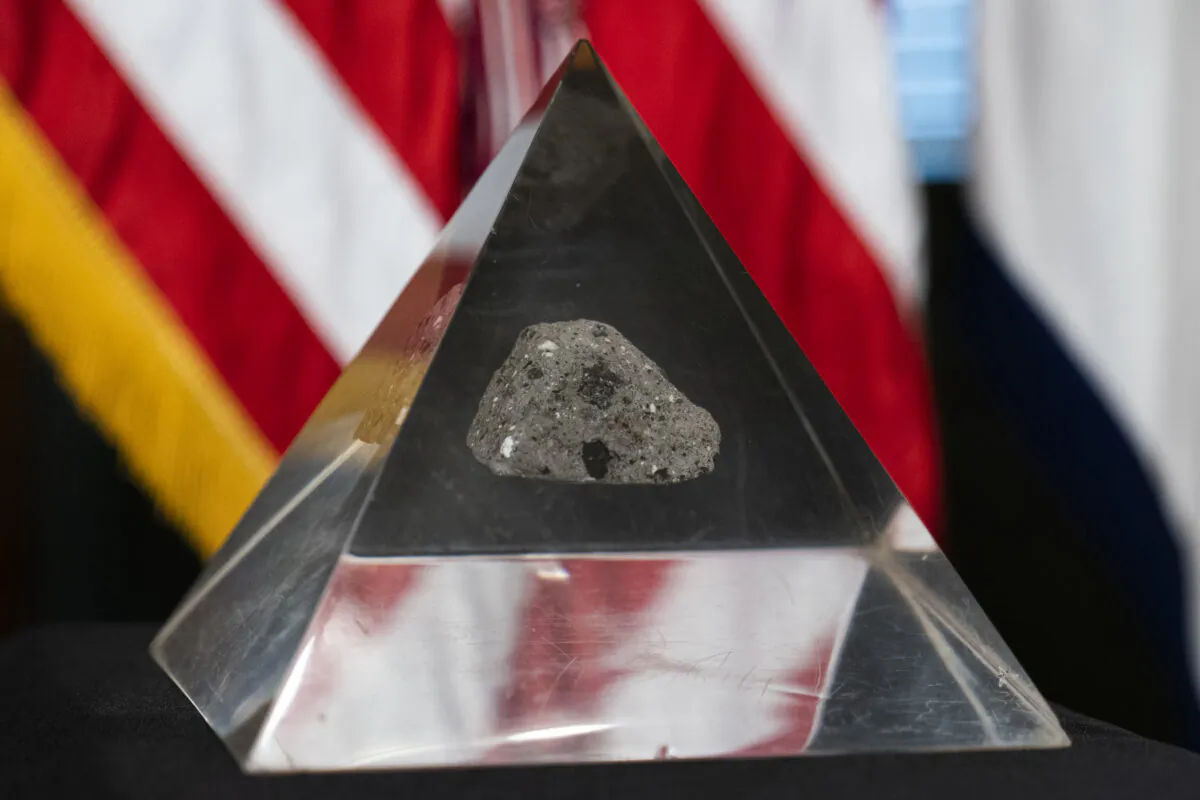A fragment of the moon rock collected by astronaut John Young, commander of the Apollo 16 lunar mission, is displayed, in Washington on May 3, 2021. (Manuel Balce Ceneta/AP Photo)