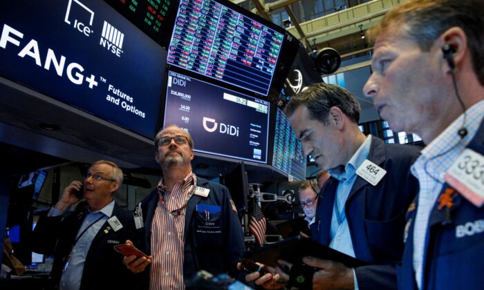 Traders work during the IPO for Chinese ride-hailing company Didi Global Inc. on the New York Stock Exchange (NYSE) floor in New York on June 30, 2021. (Brendan McDermid/Reuters)