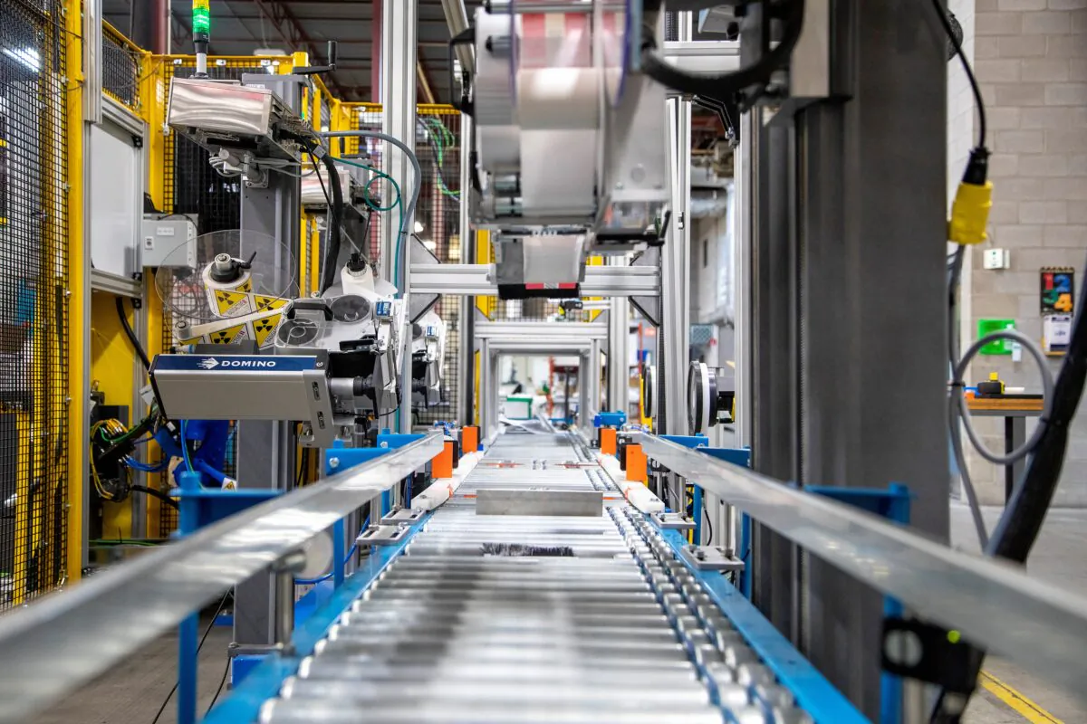 An automated packing line at Promation, a robotics engineering and automation manufacturing firm in Oakville, Ontario, Canada, on March 12, 2021. (Carlos Osorio/Reuters)