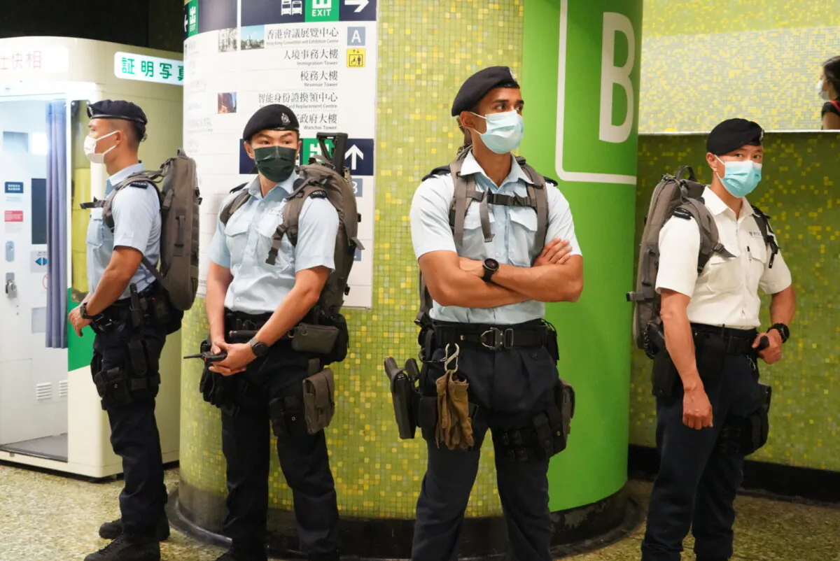 Counterterrorism police guard a metro station in Hong Kong on October 1, 2021. (Sung Pi-lung/The Epoch Times) 