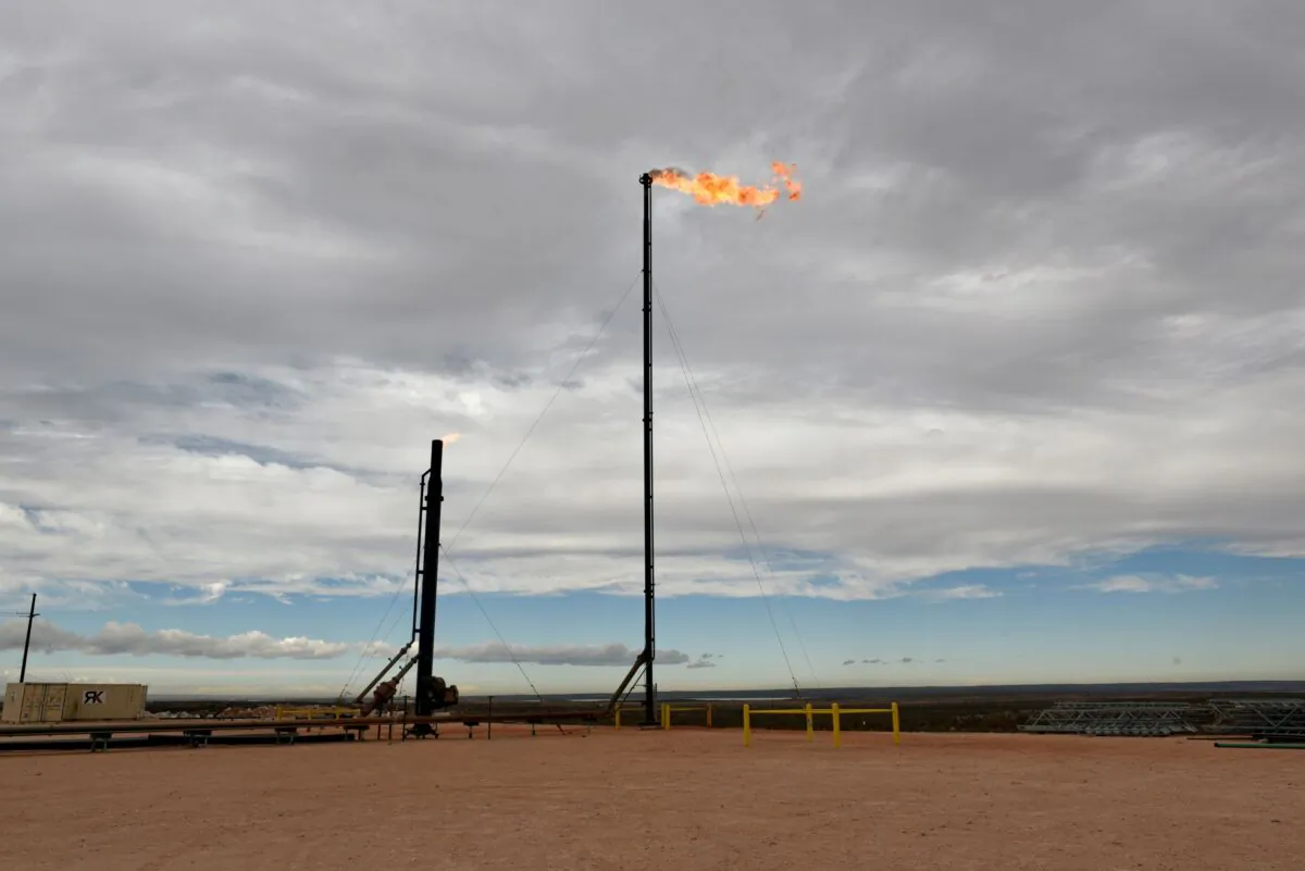 Natural gas flares off at a production facility owned by Exxon near Carlsbad, N.M., on Feb., 11, 2019. (Nick Oxford/Reuters)