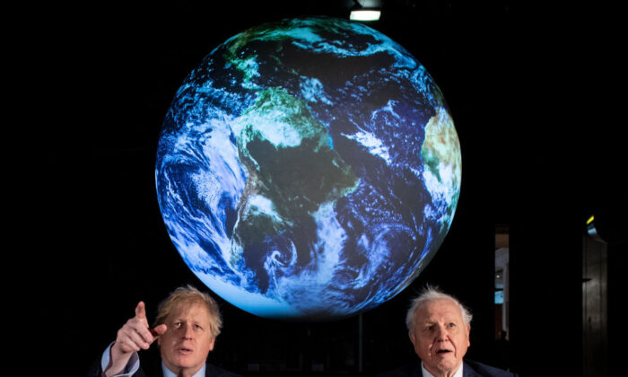 British Prime Minister Boris Johnson (L) and British broadcaster David Attenborough speak with school children during the launch of the UK-hosted COP26 U.N. Climate Summit, which will take place this autumn in Glasgow, at the Science Museum in London, England, on Feb. 4, 2020. (Chris J. Ratcliffe/WPA Pool/Getty Images)
