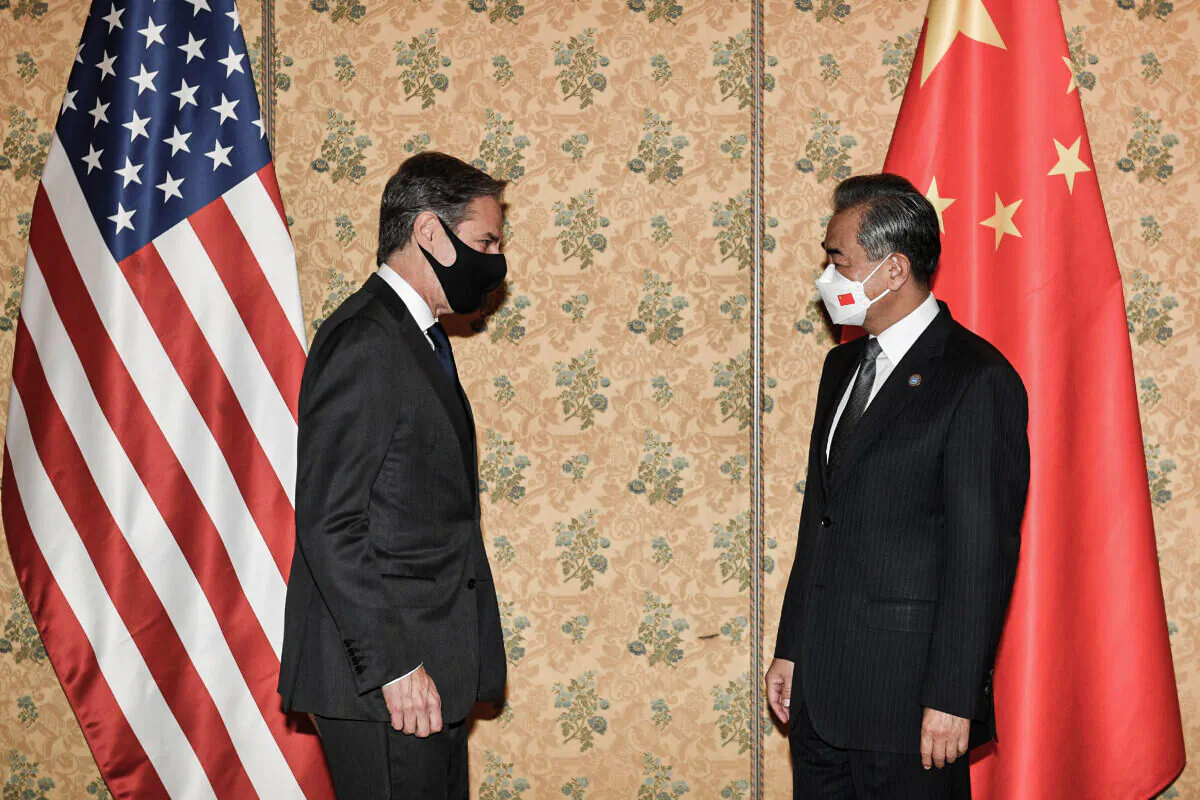 US Secretary of State Antony Blinken (L) and Chinese Foreign Minister, Wang Yi (R) meet at an hotel in Rome on the sidelines of the G20 of World Leaders Summit ON Oct. 31, 2021 . (AP Photo/Tiziana Fabi, pool)
