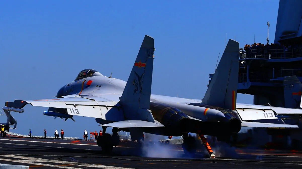 A J-15 fighter jet landing on China's sole operational aircraft carrier, the Liaoning, during a drill at sea on April 24, 2018. (AFP via Getty Images)