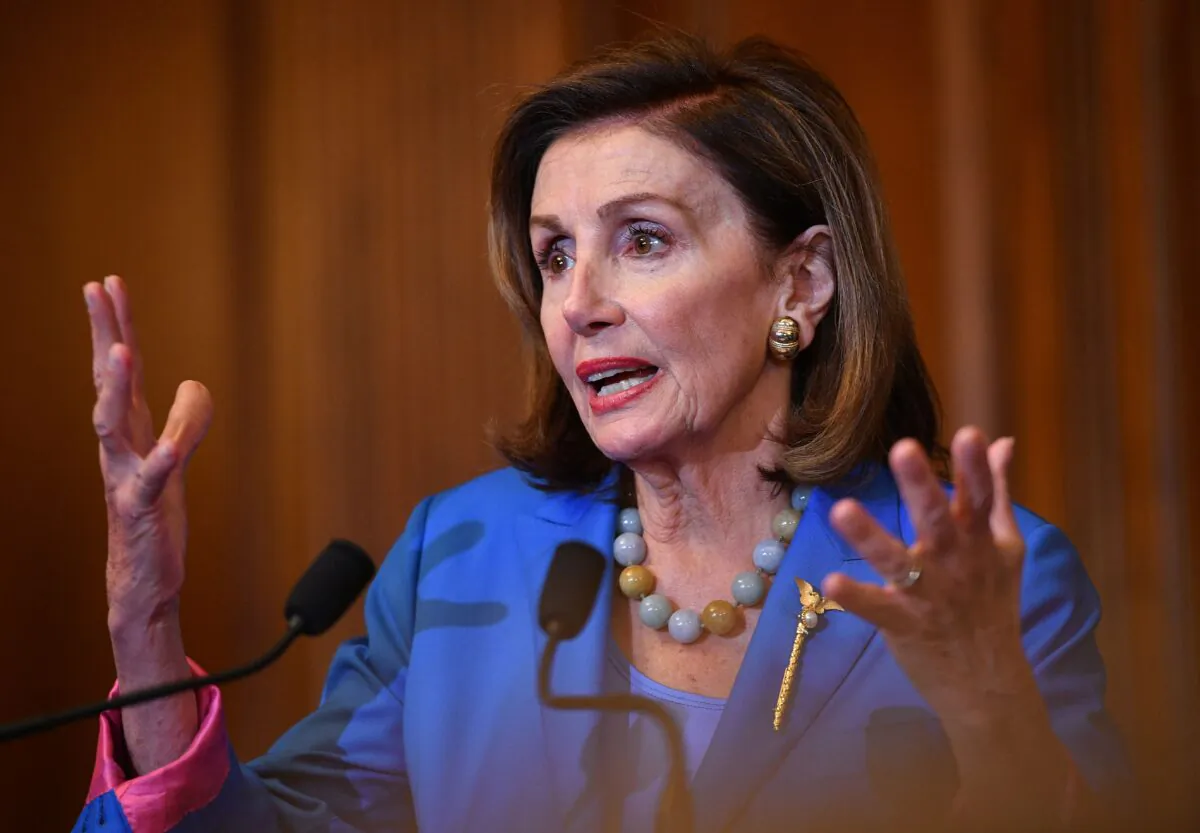 House Speaker Nancy Pelosi (D-Calif.) speaks before signing a bill to fund the U.S. government avoiding a federal shutdown at the U.S. Capitol in Washington on Sept. 30, 2021. (Mandel Ngan/AFP via Getty Images)
