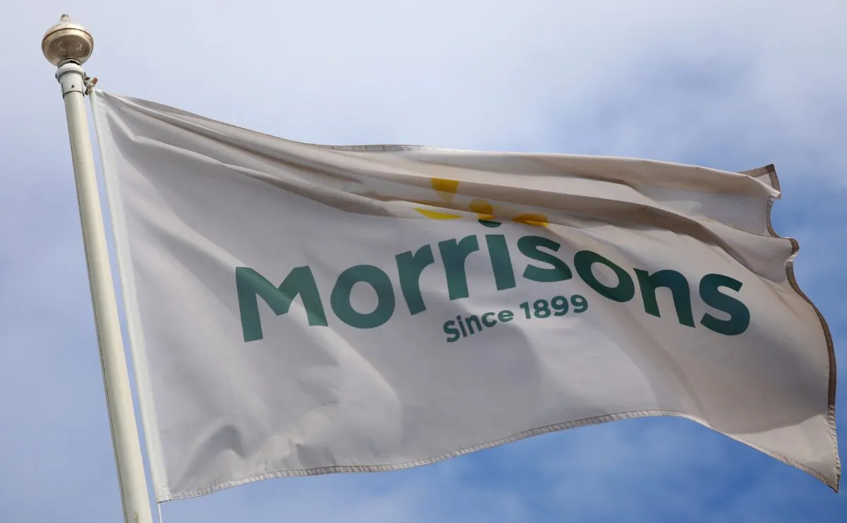 A flag flies outside a Morrisons supermarket in New Brighton, Britain, on July 5, 2021. (Phil Noble/Reuters)