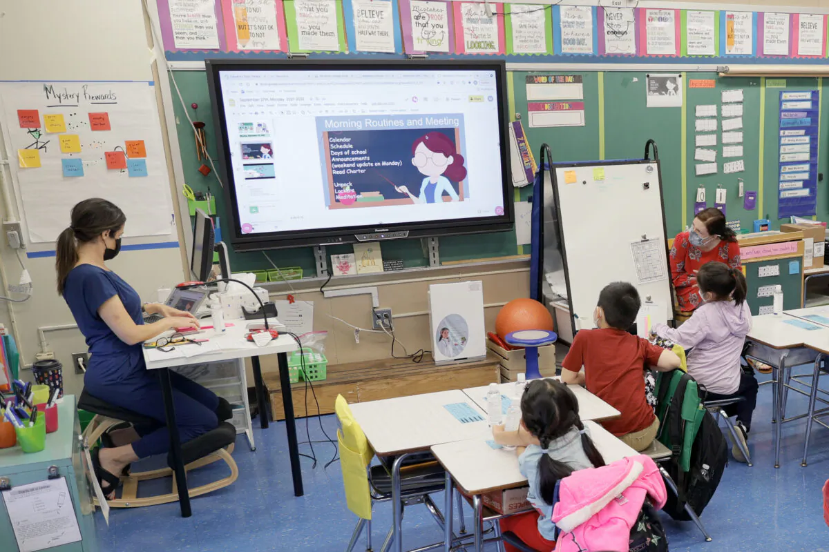 Teachers and students are seen in Yung Wing School P.S. 124 in New York City on Sept. 27, 2021. (Michael Loccisano/Getty Images)
