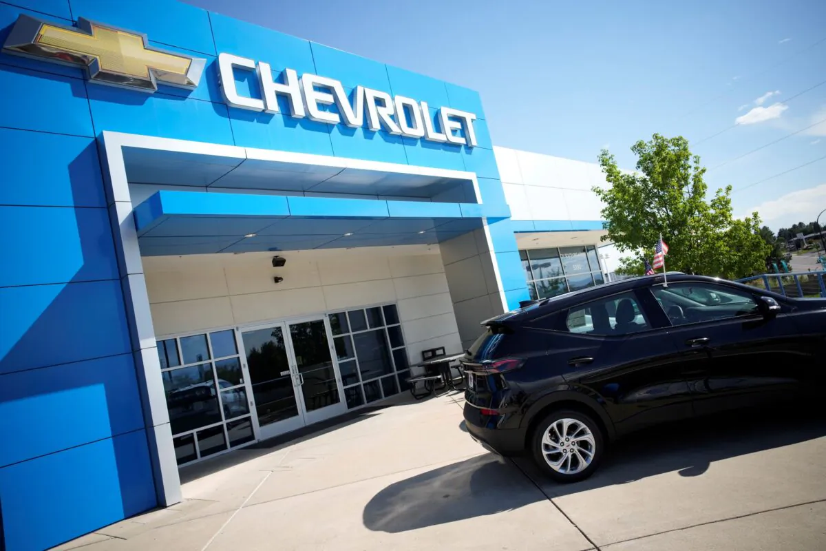 A pair of unsold 2022 Bolt electric vehicles sit outside a Chevrolet dealership in Englewood, Colo., on Sept. 12, 2021. (David Zalubowski/AP Photo)
