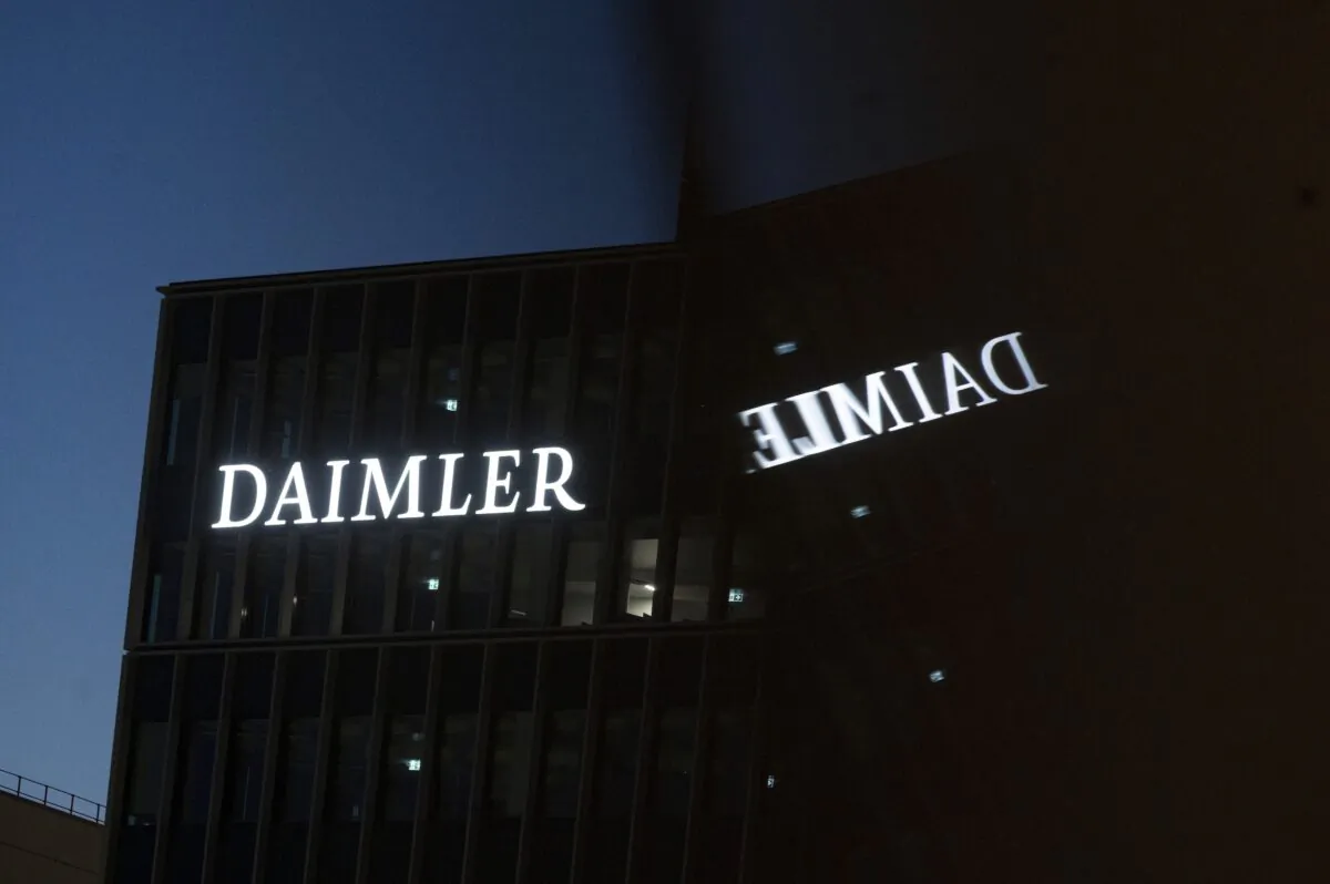 Daimler AG's corporate headquarters reflected in a window in Stuttgart, Germany on Sept. 30, 2021. (Marijan Murat/dpa via AP)