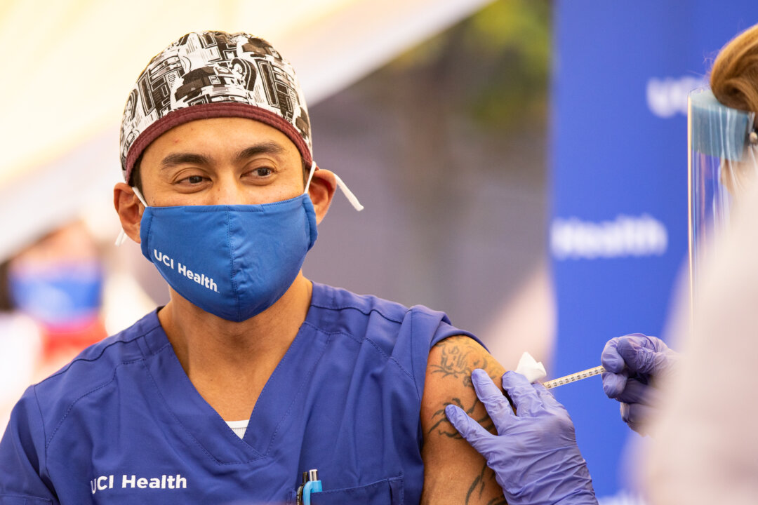 Healthcare workers at St. Joseph Hospital in Orange, Calif., on Dec. 16, 2020. (John Fredricks/The Epoch Times)