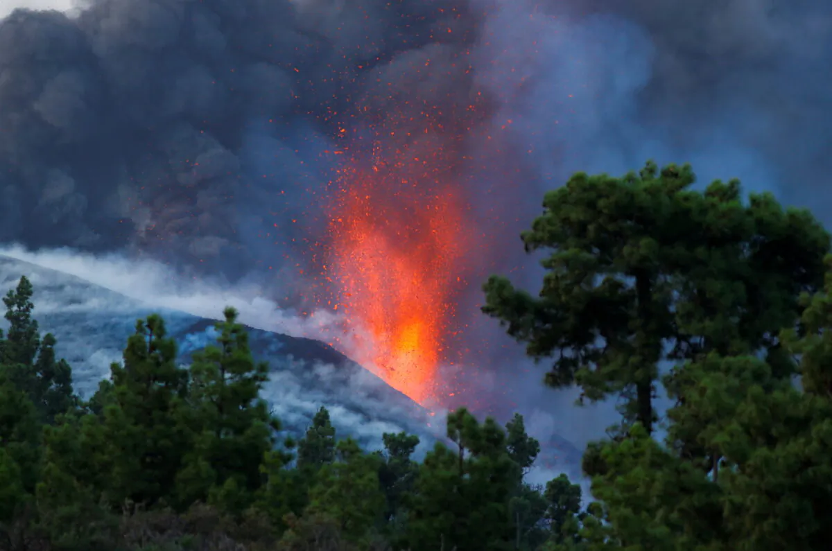 The Cumbre Vieja volcano continues to erupt on the Canary Island of La Palma, as seen from Tacande, Spain, on Oct. 2, 2021. (Borja Suarez/Reuters)