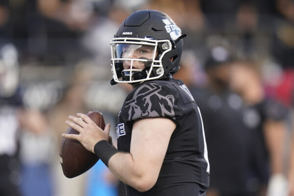 Utah State quarterback Logan Bonner (1) warms up