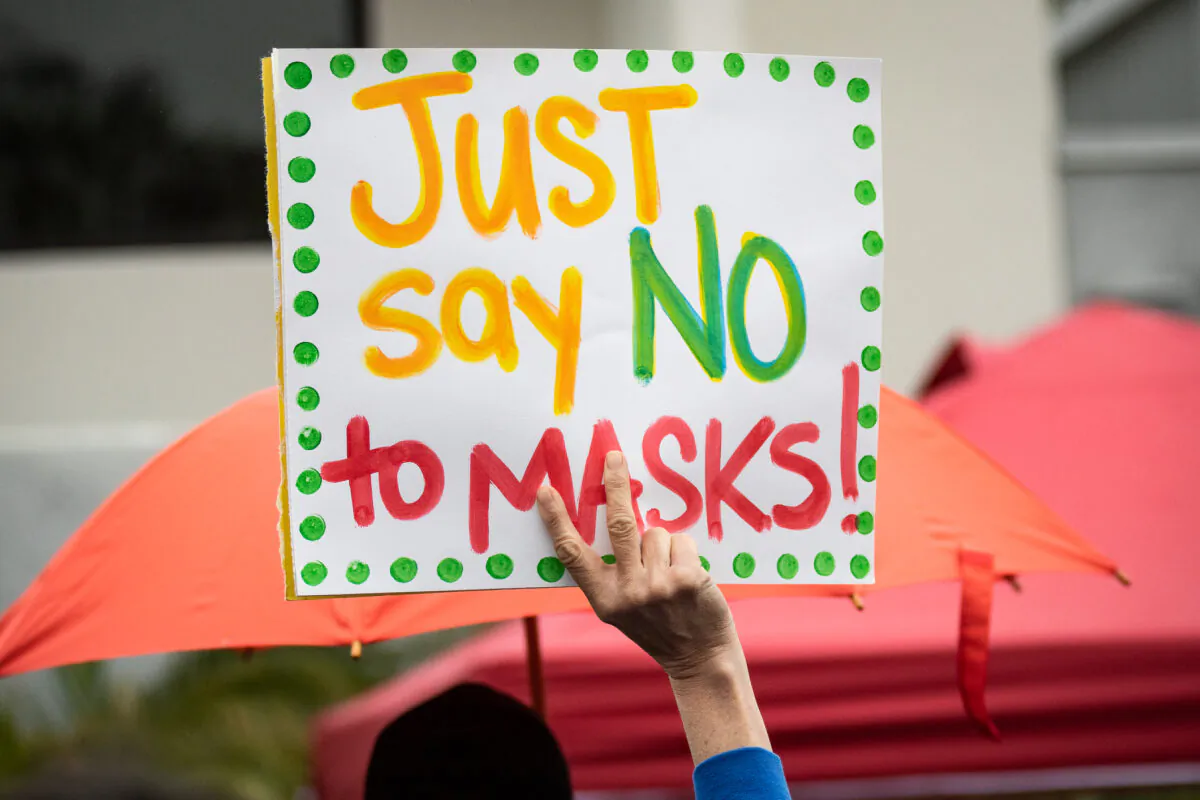 Parents and students gather in protests of wearing masks in schools in front of The Orange County Board of Education in Costa Mesa, Calif., on May 17, 2021. (John Fredricks/The Epoch Times)