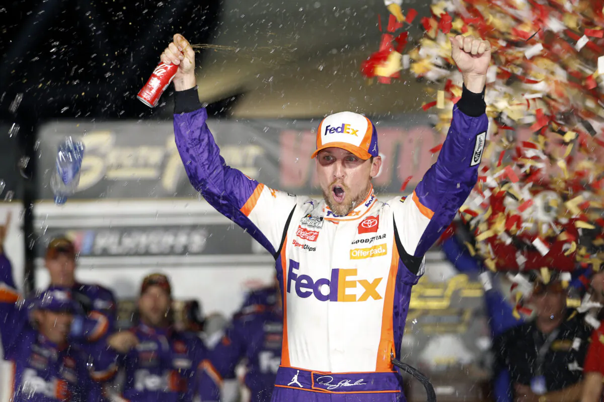 NASCAR Cup Series driver Denny Hamlin (11) celebrates in victory lane after winning a NASCAR Cup Series auto race at the Las Vegas Motor Speedway in Las Vegas on Sept. 26, 2021. (Steve Marcus/AP Photo)