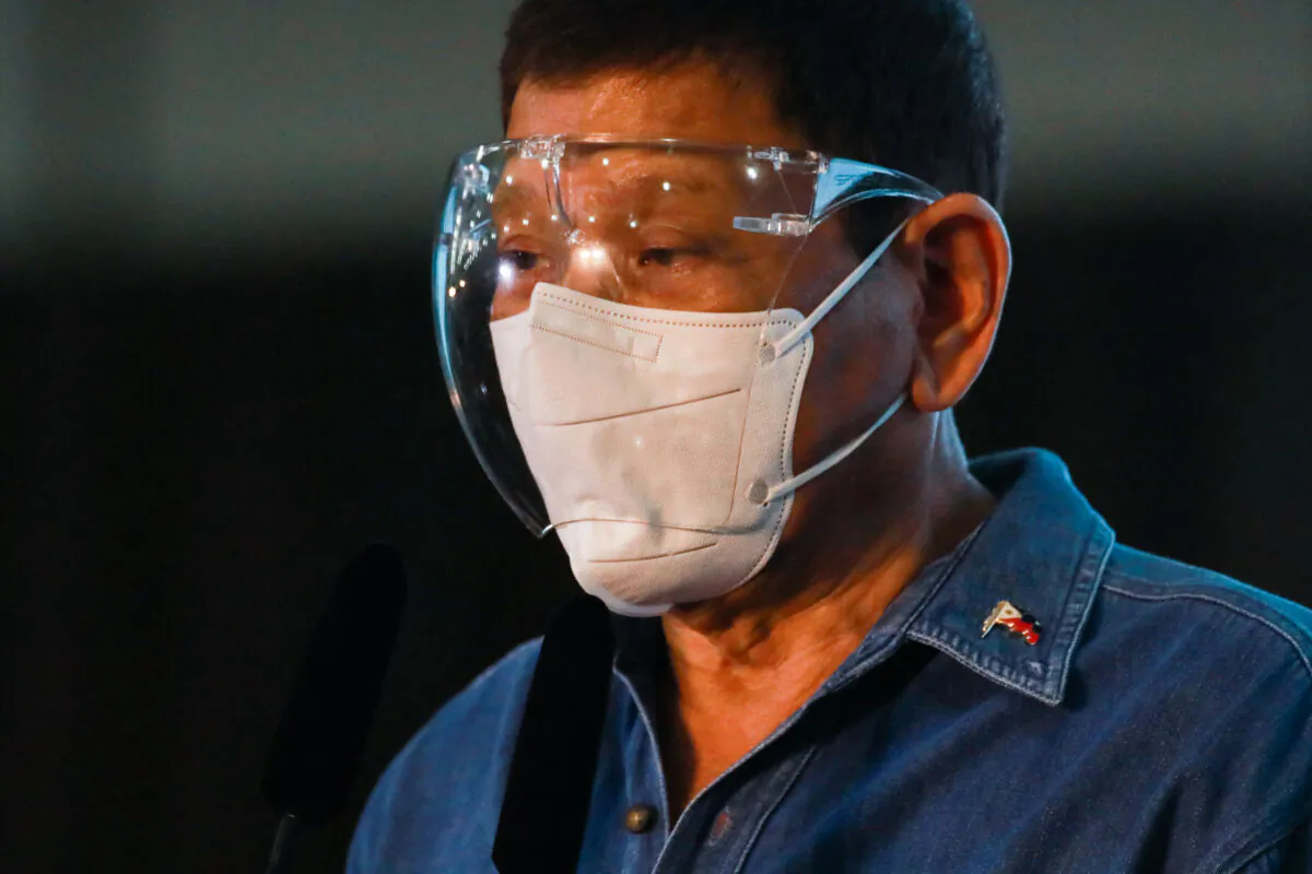 Philippine President Rodrigo Duterte speaks to the media after Philippine Senator Christopher "Bong" Go filed his certificate of candidacy to join the vice presidential race in Pasay City, metro Manila on Oct. 2, 2021. (Lisa Marie David/POOL/AFP via Getty Images)