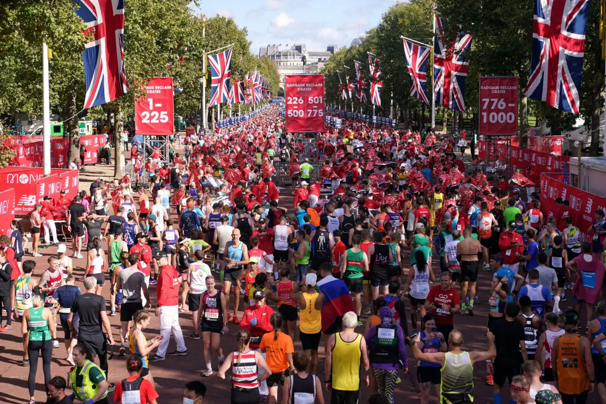 Runners after finishing the Virgin Money London Marathon 2021 in London, on Oct. 3, 2021. (Yui Mok/PA)