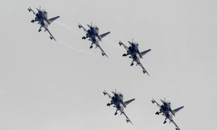 J-10 fighter jets from the August 1st Aerobatics Team of the People's Liberation Army Air Force perform during the 10th China International Aviation and Aerospace Exhibition in Zhuhai, Guangdong province on Nov. 11, 2014. (Reuters/Alex Lee)