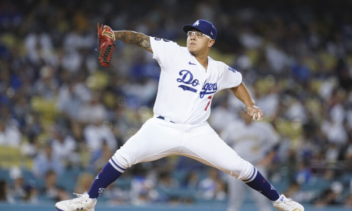 Los Angeles Dodgers relief pitcher Julio Urias (7) throws during the first inning of a baseball game against the Milwaukee Brewers in Los Angeles on Oct. 2, 2021. (AP Photo/Ashley Landis)