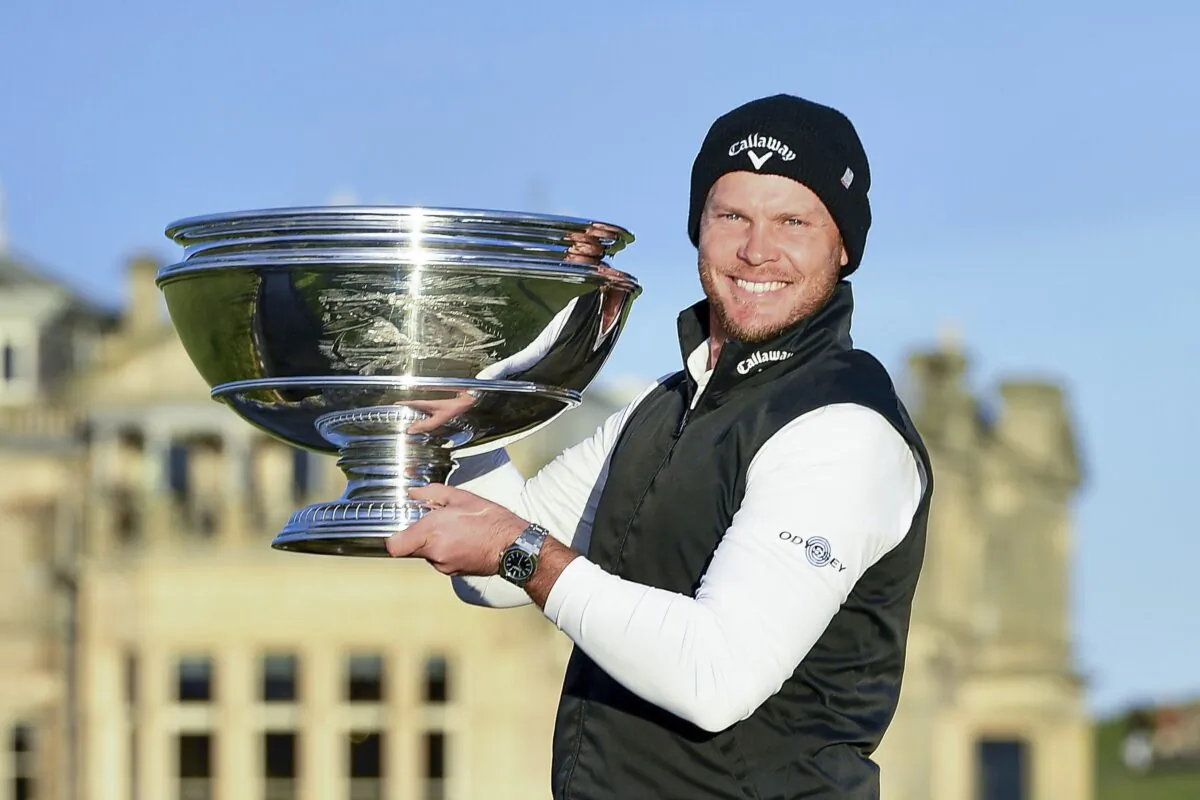 England's Danny Willett poses with the trophy after winning the Alfred Dunhill Links Championship at St Andrews, Scotland, on Oct. 3, 2021. (Malcolm Mackenzie/PA via AP)