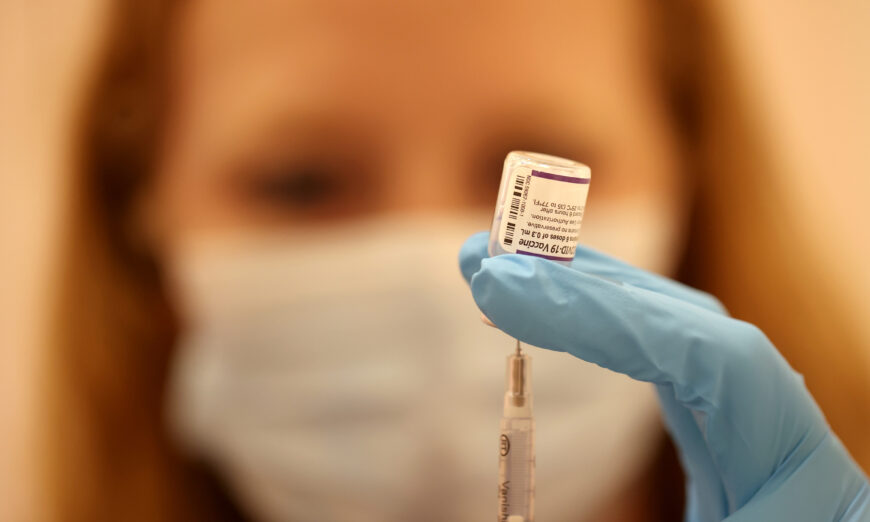 Safeway pharmacist Ashley McGee fills a syringe with the Pfizer COVID-19 vaccination in California on Oct. 1, 2021. (Justin Sullivan/Getty Images)