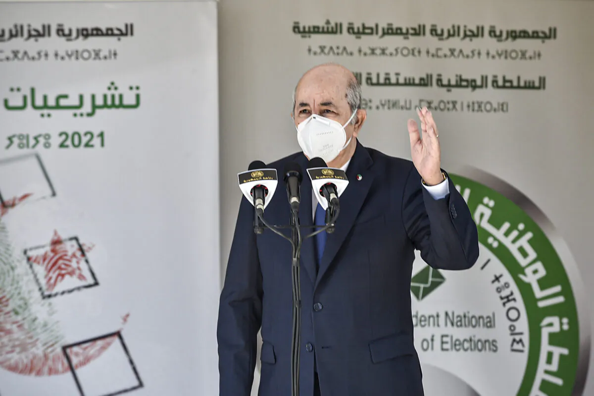 Algeria's President Abdelmadjid Tebboune speaks outside a polling station in Bouchaoui, on the western outskirts of Algeria's capital Algiers, on June 12, 2021. (Ryad Kramdi/AFP via Getty Images)
