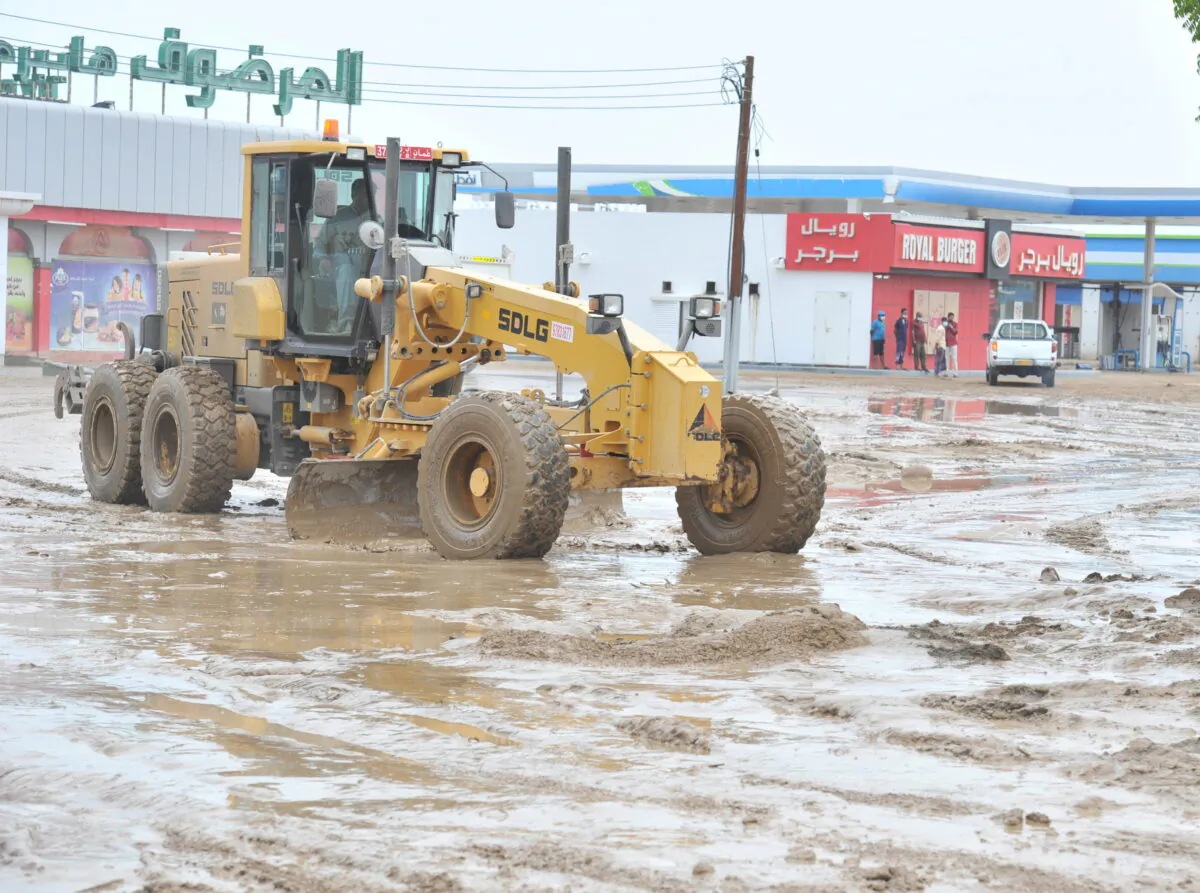 Workers repair damages caused by Cyclone Shaheen in Al Musanaa, Al Batina region, Oman, on Oct. 4, 2021(Oman News Agency/Handout via Reuters) 