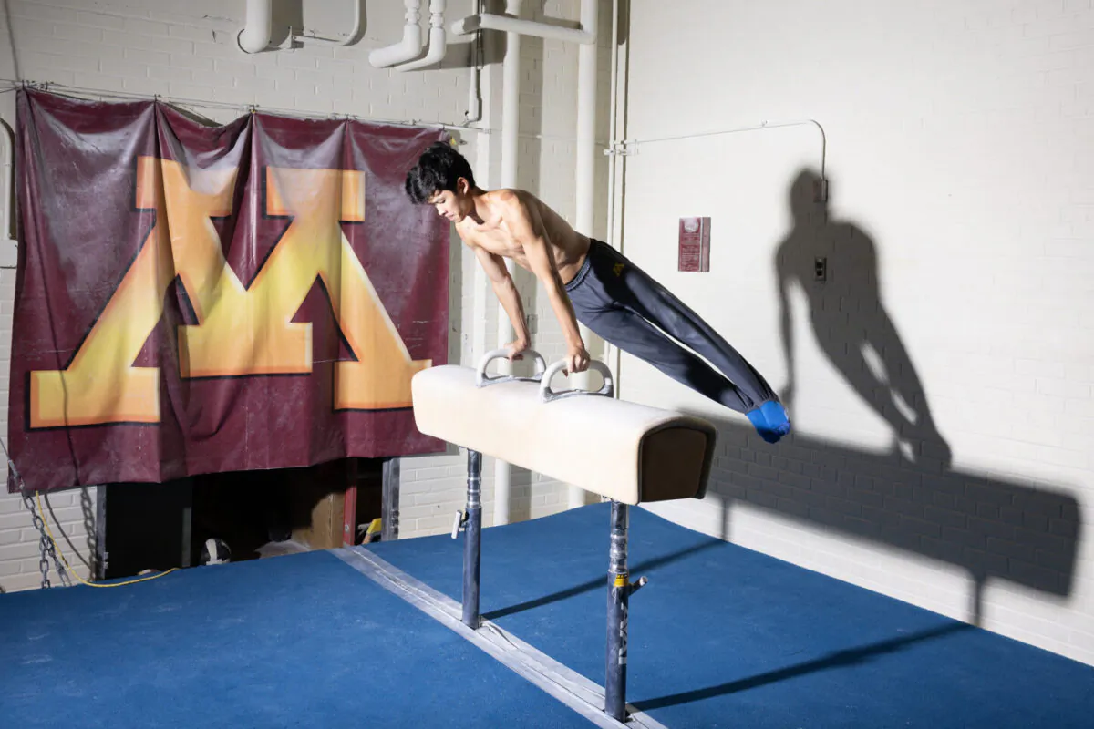 Student Evan Ng, a gymnast, practices at the University of Minnesota in this undated photo. He is suing the school, claiming the elimination of its century-old gymnastics team is illegal sex-based discrimination. (Courtesy Pacific Legal Foundation)

