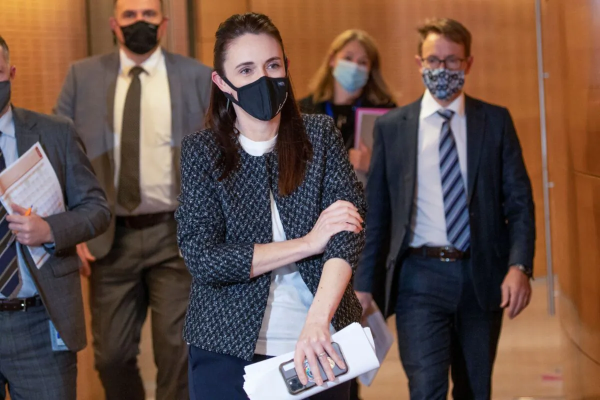 New Zealand Prime Minister Jacinda Ardern arrives with director general of health Dr Ashley Bloomfield (R) for the post-Cabinet press conference at Parliament in Wellington, New Zealand, on Oct. 4, 2021. (Mark Mitchell/Pool Photo via AP)
