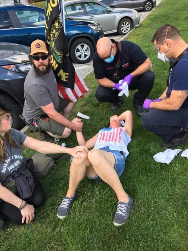 Karen 'Kay Sea' Skau is attended by paramedics after being assaulted at a Vermont Liberty rally at the Vermont State House on May 15, 2021. (Photo courtesy of Karen Skau)