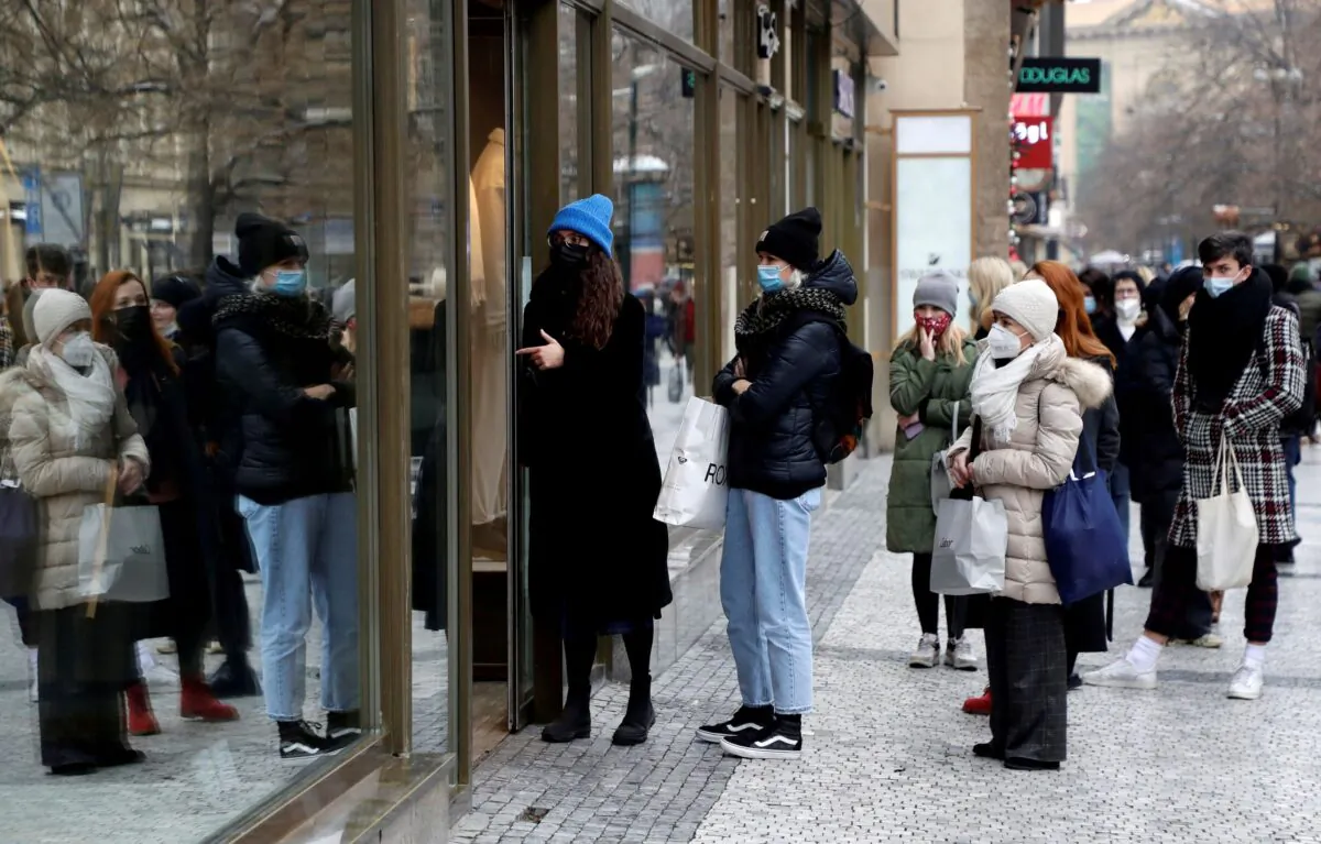 Customers queue in front of the re-opened shop, as restrictions ease following the coronavirus disease outbreak in Prague, Czech Republic on Dec. 3, 2020. (David W Cerny/Reuters)