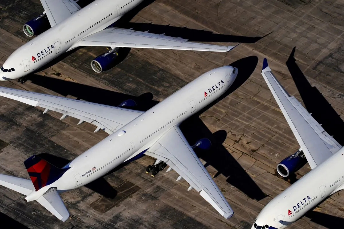 Delta Air Lines passenger planes parked due to flight reductions made to slow the spread of COVID-19) at Birmingham-Shuttlesworth International Airport in Birmingham, Ala., on March 25, 2020. (Elijah Nouvelage/Reuters)