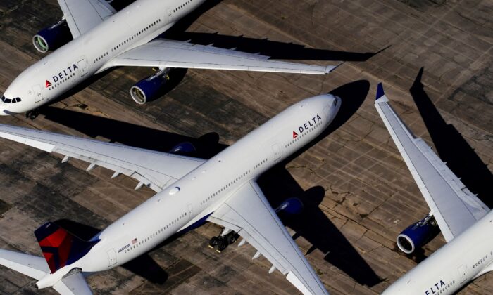 Delta Air Lines passenger planes are seen parked due to flight reductions made to slow the spread of coronavirus disease (COVID-19), at Birmingham-Shuttlesworth International Airport in Birmingham, Ala., on March 25, 2020. (Elijah Nouvelage/Reuters)