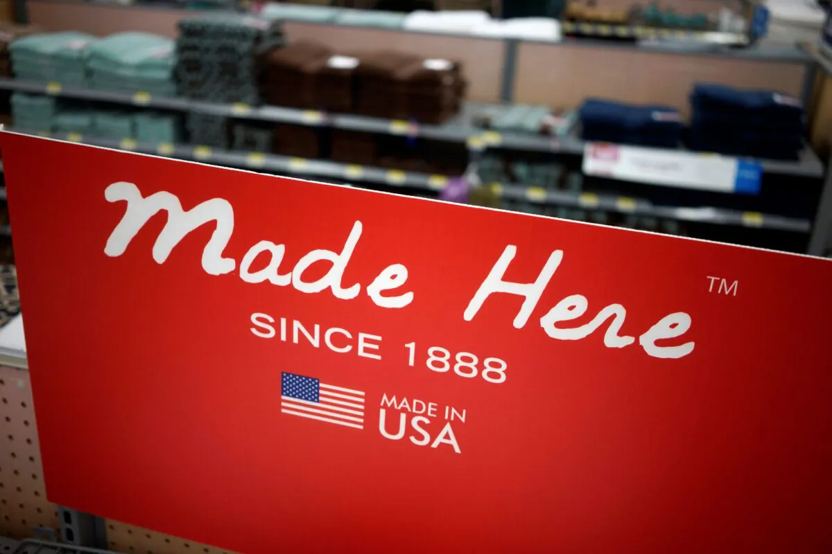 A sign advertising towels made in the United States is seen at the Walmart Supercenter in Bentonville, Ark., on June 5, 2014. (Rick Wilking/Reuters)