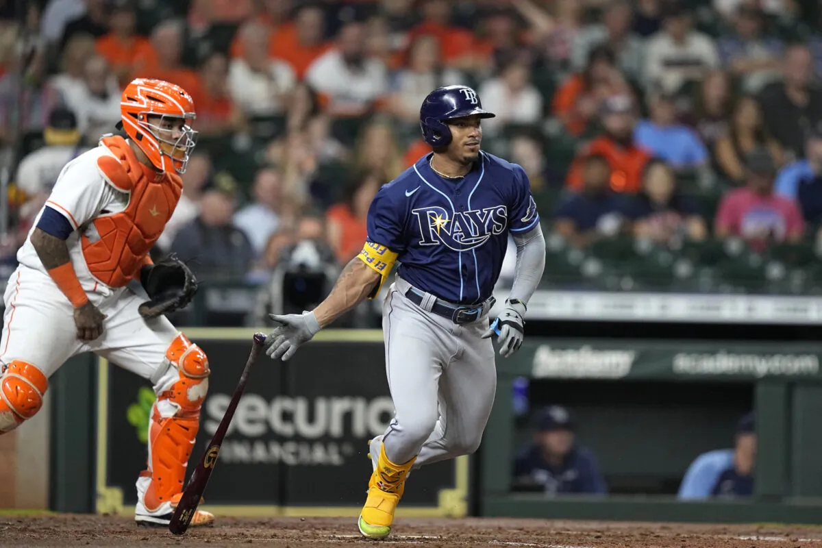Tampa Bay Rays' Wander Franco, right, hits into a force out as Houston Astros catcher Martin Maldonado watches during the fourth inning of a baseball game in Houston on Sept. 30, 2021. (David J. Phillip/AP Photo)