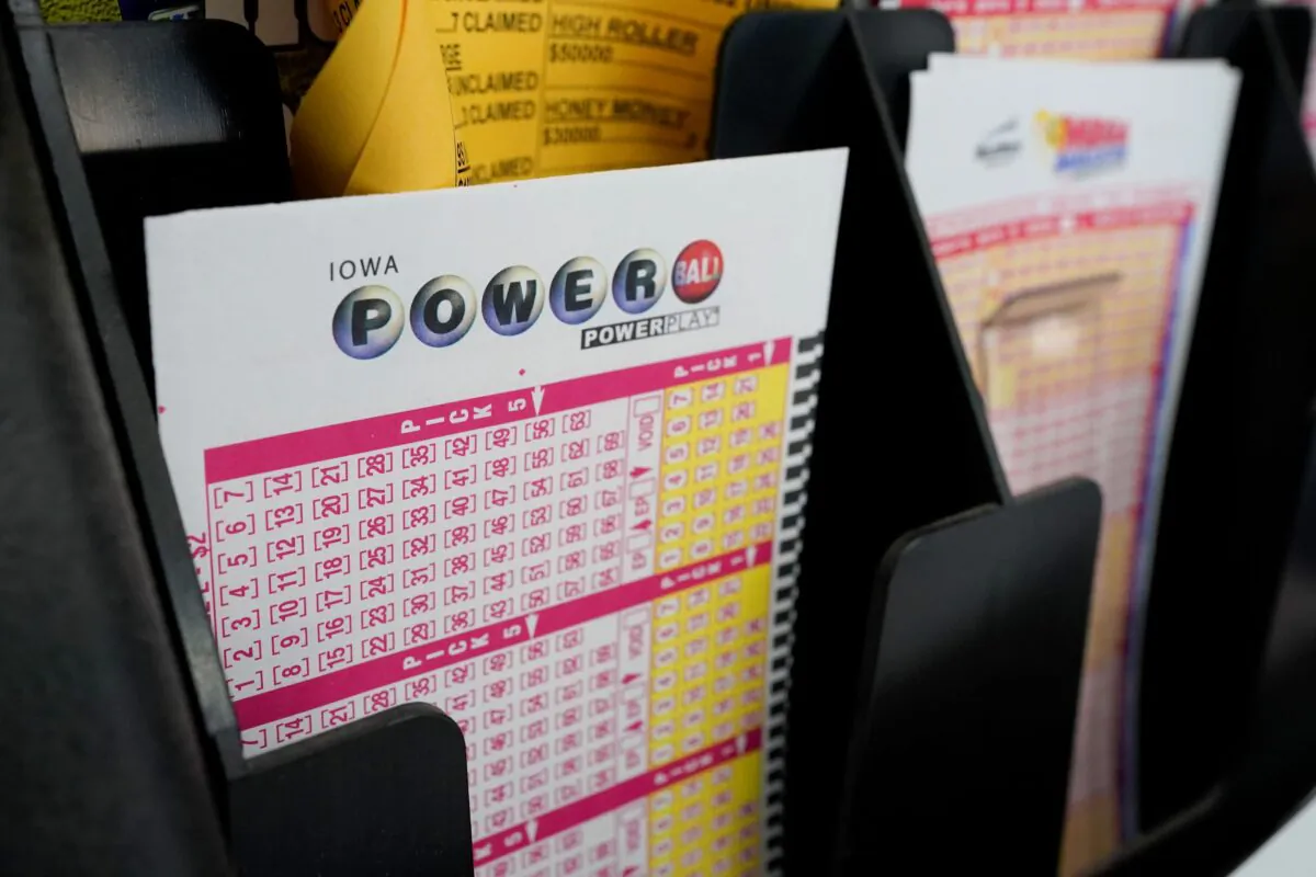 Blank forms for the Powerball lottery sit in a bin at a local grocery store, in Des Moines, Iowa, on Jan. 12, 2021. (Charlie Neibergall/AP Photo)