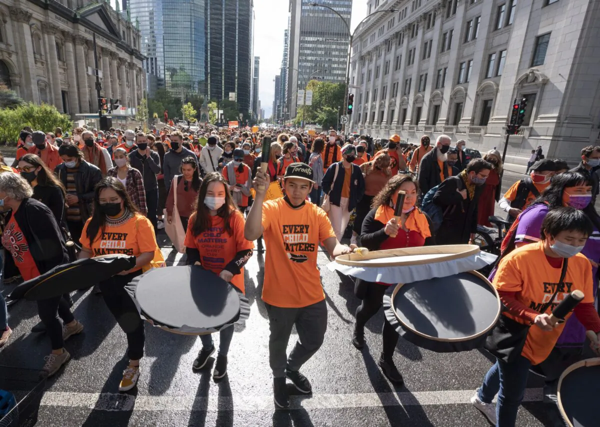 People take part in a march to mark the first National Day of Truth and Reconciliation, in Montreal on Sept. 30, 2021. (The Canadian Press/Ryan Remiorz)
