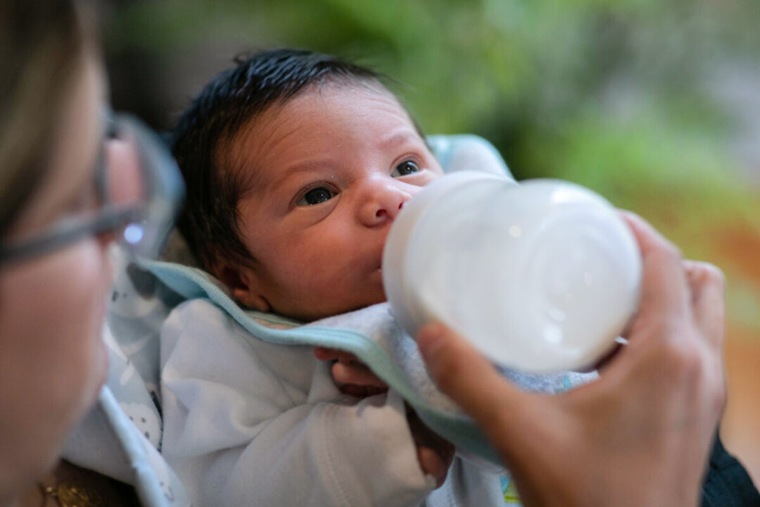Stamford Elementary school teacher Luciana Lira, 42, feeds baby Neysel, then two-and-a-half weeks old, in Stamford, Connecticut, on April 20, 2020. (John Moore/Getty Images)