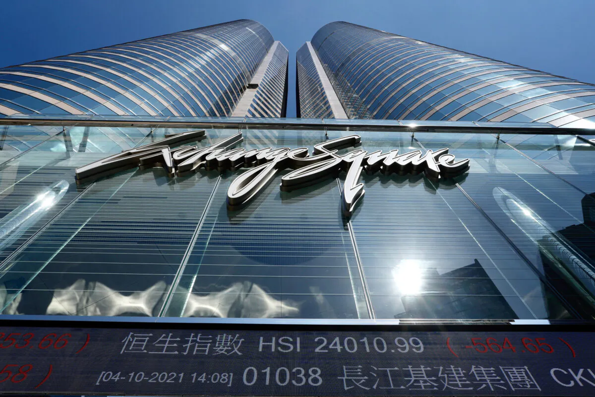 A bank's electronic board displays the Hong Kong share index at Hong Kong Stock Exchange on Oct. 4, 2021. (AP Photo/Vincent Yu)