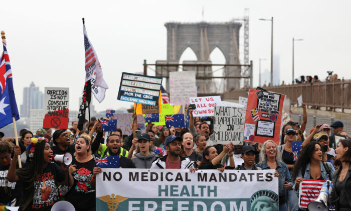 People march as they protest against NYC's COVID-19 vaccine mandate that went into effect today for public school employees in New York City on Oct. 4, 2021. (Michael M. Santiago/Getty Images)