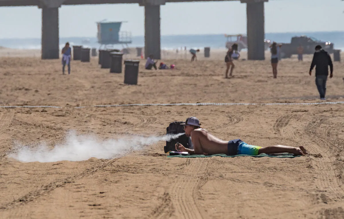A man vapes in Huntington Beach, Calif., on Oct. 5, 2021. (John Fredricks/The Epoch Times)