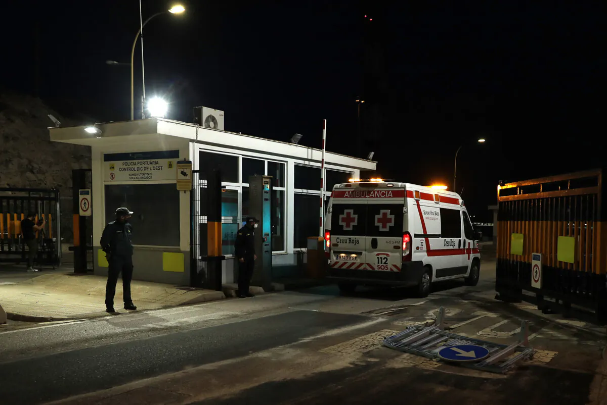 An ambulance enters the port of Palma de Mallorca as Spanish rescuers pulled 14 people to safety, in the sea off the Island of Cabrera, on Mallorca Island on Oct. 4, 2021. (Jaime Reine/AFP via Getty Images)
