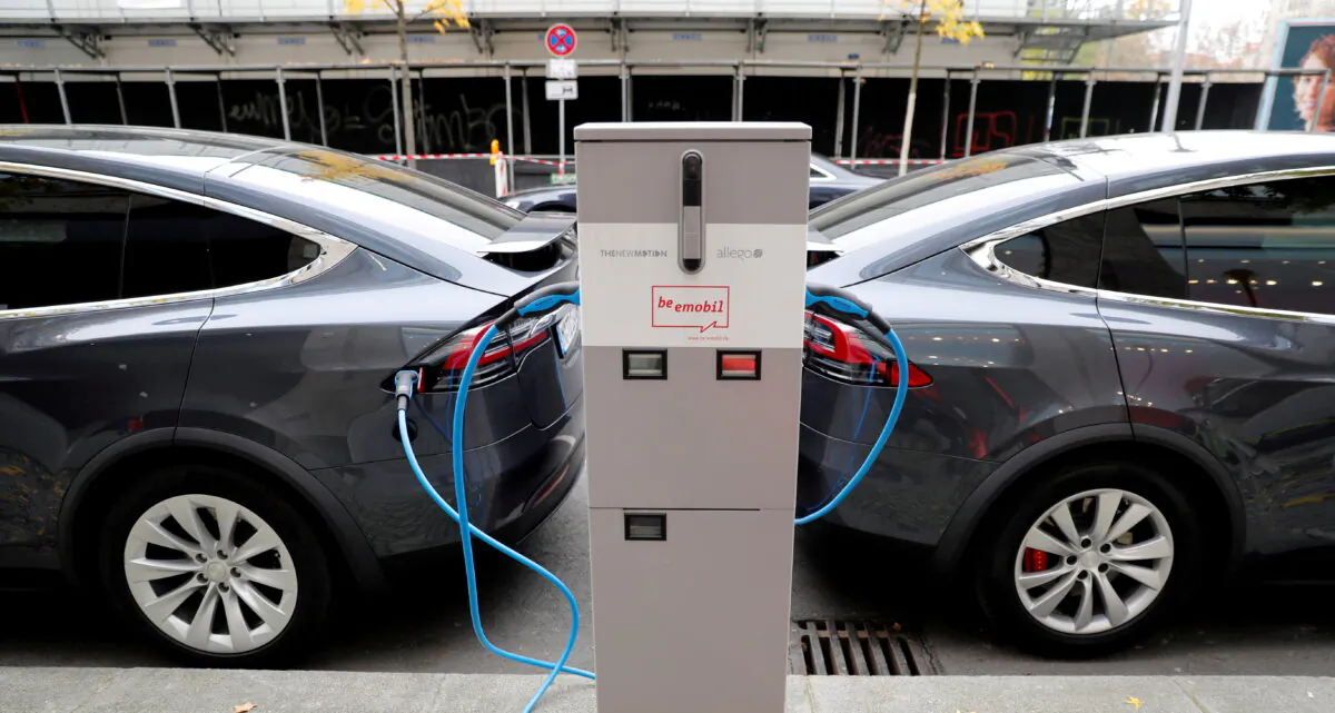 Tesla Model X electric cars recharge their batteries in Berlin, Germany, on Nov. 13, 2019. (Fabrizio Bensch/Reuters)