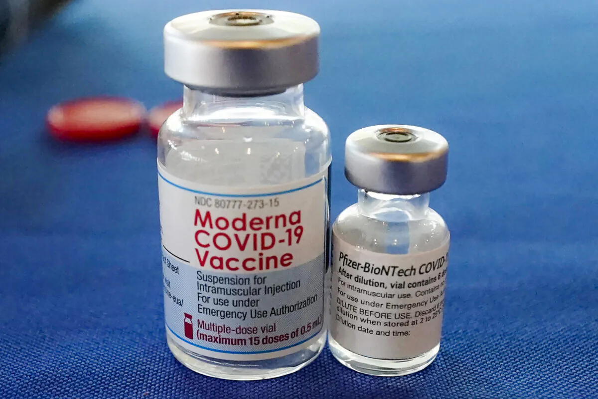 Vials of the Pfizer and Moderna COVID-19 vaccines are seen in Jackson, Miss., on Sept. 21, 2021. (Rogelio V. Solis/AP Photo)
