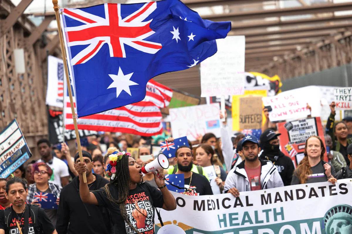 People march as they protest against NYC's COVID-19 vaccine mandate that went into effect today for public school employees in New York City, on Oct. 4, 2021. (Michael M. Santiago/Getty Images)