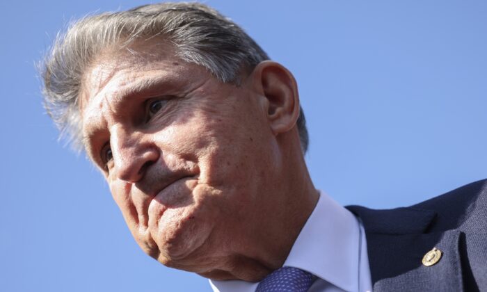 Sen. Joe Manchin (D-W.Va.) speaks to reporters in Washington in a file photograph. (Kevin Dietsch/Getty Images)