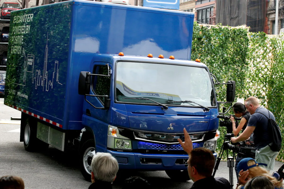 A new Daimler AG, FUSO battery-powered eCanter urban delivery truck is unveiled during a news conference in New York on Sept. 14, 2017. (Brendan McDermid/Reuters)