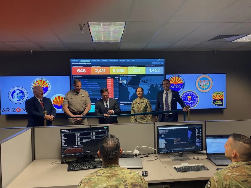Arizona Gov. Doug Ducey (center) is joined by Tim Roemer, Director of the Arizona Department of Homeland Security and Chief Information Security Officer, at an unveiling of the new Cyber Command Center in Phoenix on Oct. 4, 2021. Also pictured are Colonel Heston Silbert, Director of the Department of Public Safety; Andy Tobin, Director of the Department of Administration; and Adjutant General Kerry Muehlenbeck, Director of the Department of Emergency and Military Affairs. (Office of the Governor Doug Ducey)