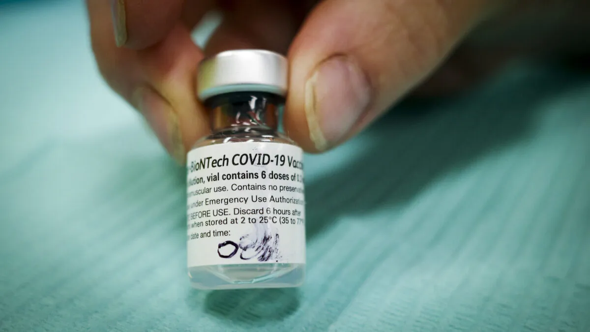 A vial of Pfizer-BioNTech COVID-19 vaccine is seen at an Alberta Health Services vaccination clinic in Didsbury, Alta., on June 29, 2021. (The Canadian Press/Jeff McIntosh)