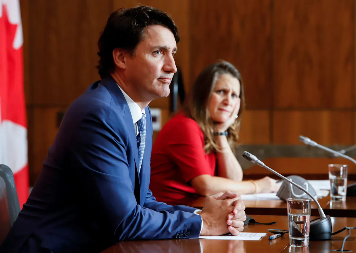 Canada's Deputy Prime Minister and Minister of Finance Chrystia Freeland, and Canada's Prime Minister Justin Trudeau listen to a question at a news conference in Ottawa, Ontario, Canada, on Oct. 6, 2021. (Reuters/Patrick Doyle)