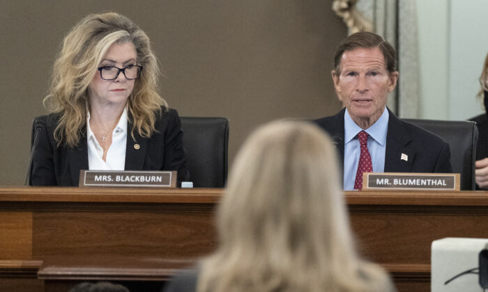Sen. Marsha Blackburn (R-Tenn.) left, and Sen. Richard Blumenthal (D-Conn.), right, speak to former Facebook data scientist Frances Haugen, center, during a hearing of the Senate Commerce, Science, and Transportation Subcommittee on Consumer Protection, Product Safety, and Data Security, on Capitol Hill in Washington, Oct. 5, 2021. (Alex Brandon/ AP Photo)